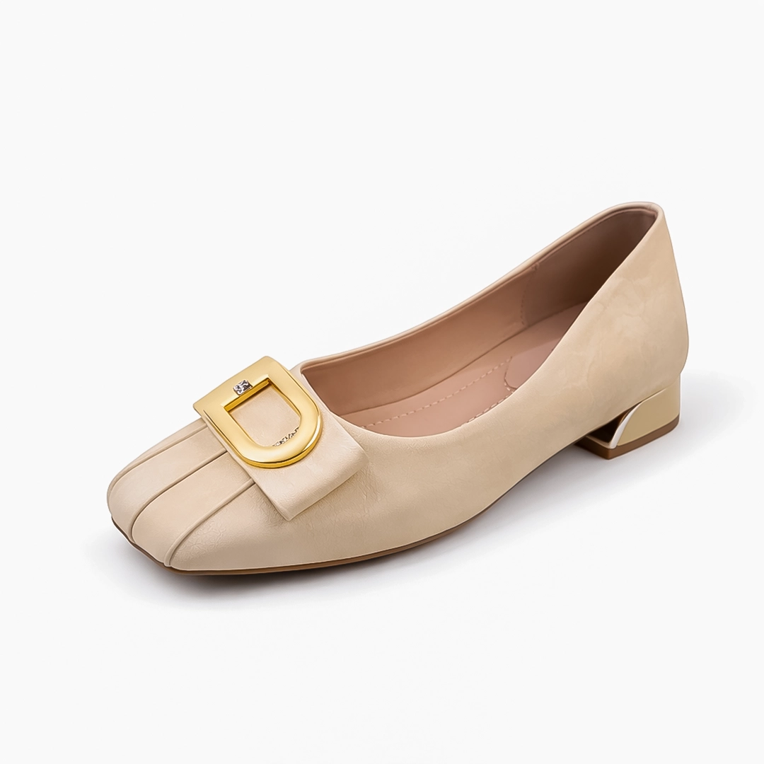 Side view of elegant cream office shoes with low block heel and metal detail