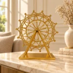 Golden Ferris wheel showpiece displayed on a luxury console table