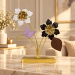 Gold floral butterfly metal showpiece displayed on a luxury dark console
