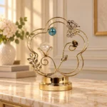 Gold butterfly crystal light decorative showpiece displayed in a luxury interior