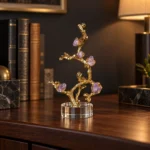 Gold branch purple crystal flower showpiece on executive bookshelf