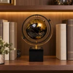 Black and gold decorative globe showpiece on luxury bookshelf