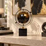 Black and gold rotating globe showpiece on living room console