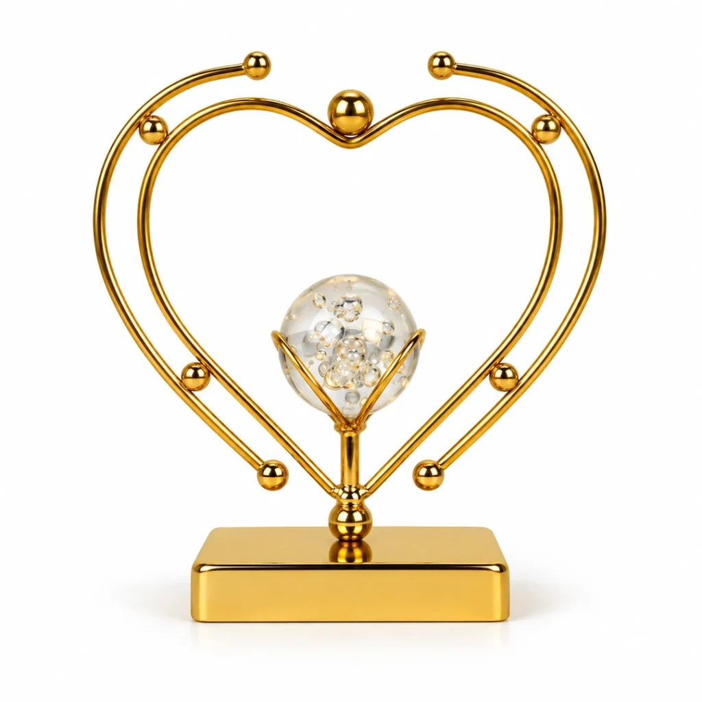 Luxury gold double heart crystal ball decorative showpiece on white background