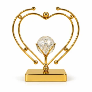 Luxury gold double heart crystal ball decorative showpiece on white background